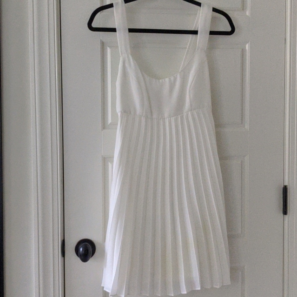 Vintage white babydoll dress with pleated skirt
